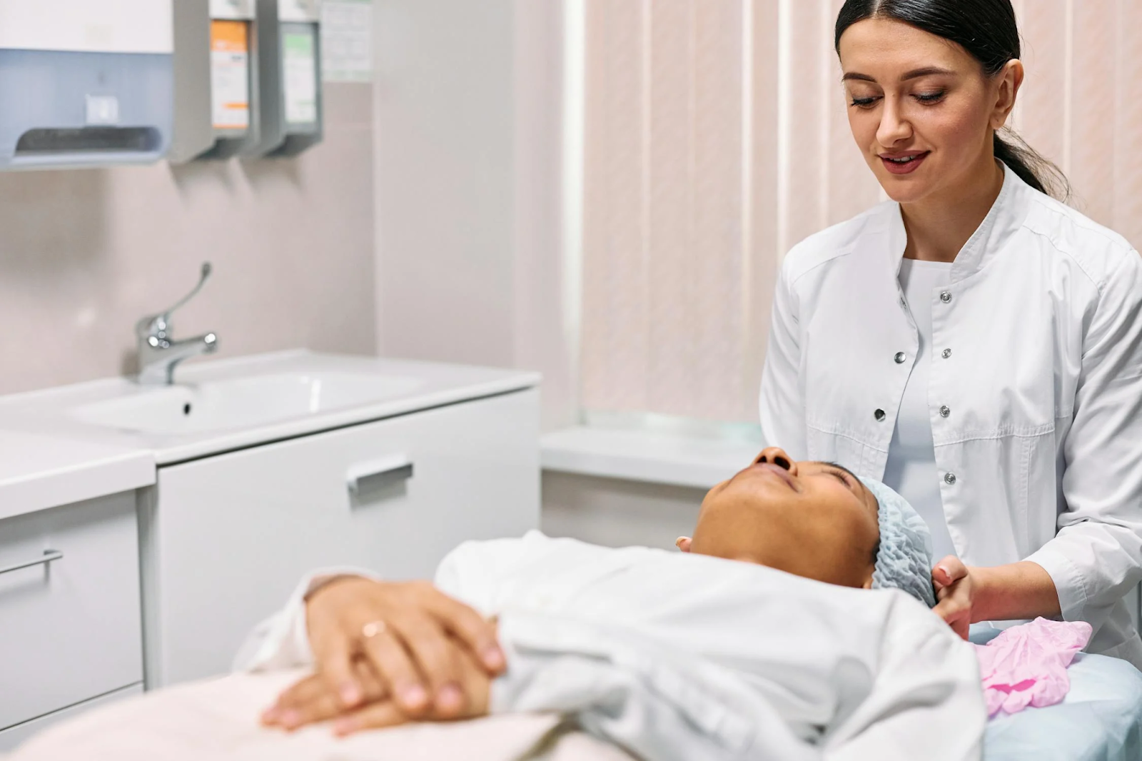 woman lying on bed during appointment