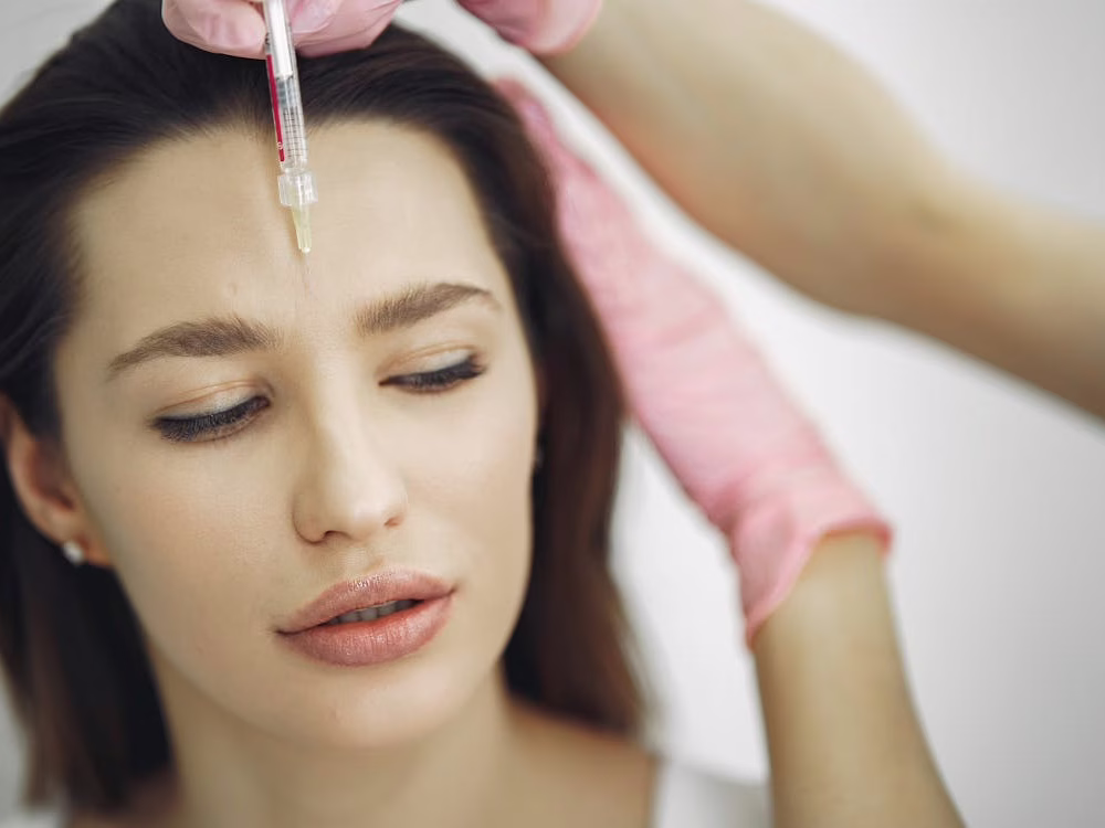 Patient receiving Botox injection from a facial plastic surgeon in Beverly Hills